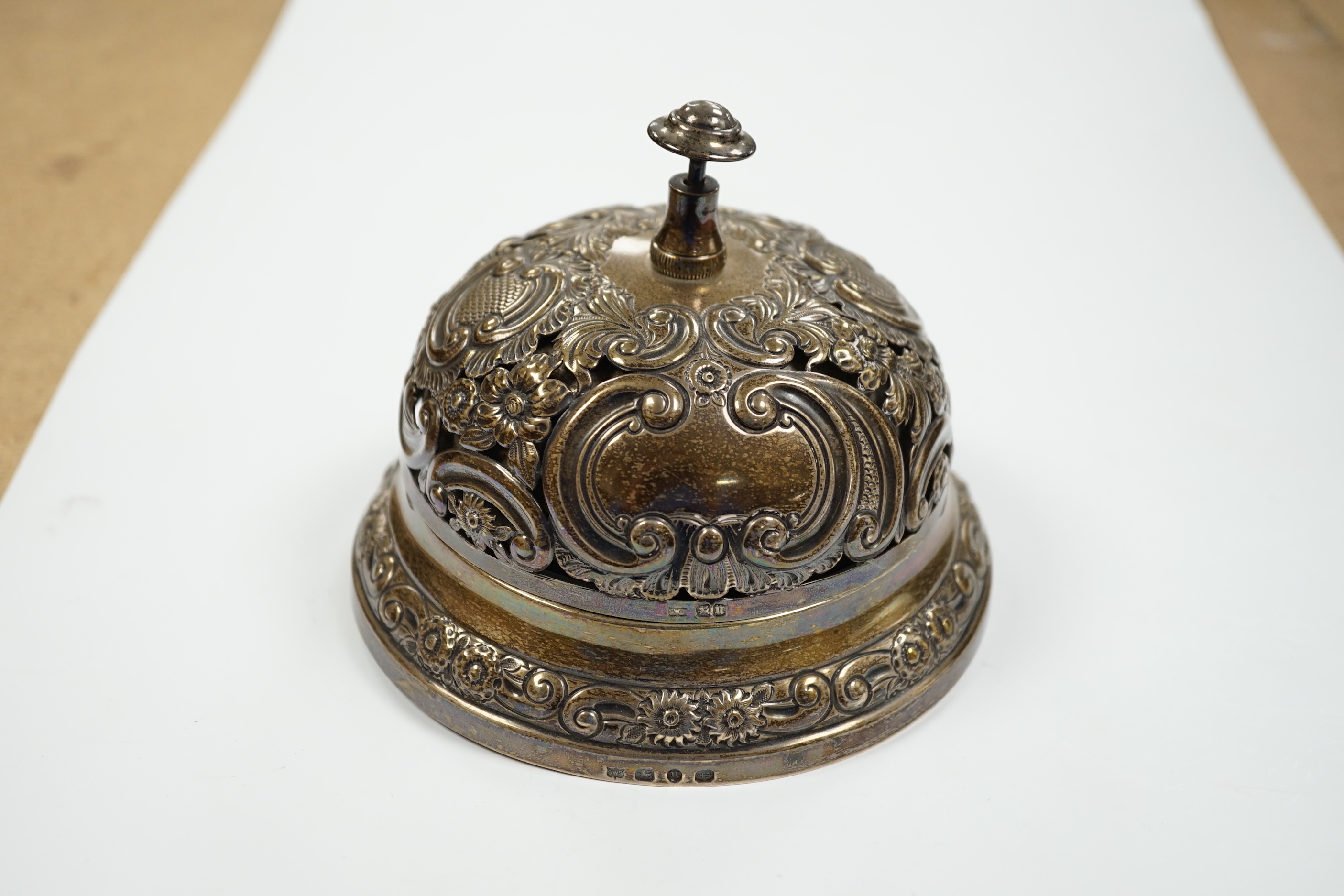 A late Victorian pierced silver mounted table bell, Samuel Walton Smith, Birmingham, 1894, base diameter 13.2cm.